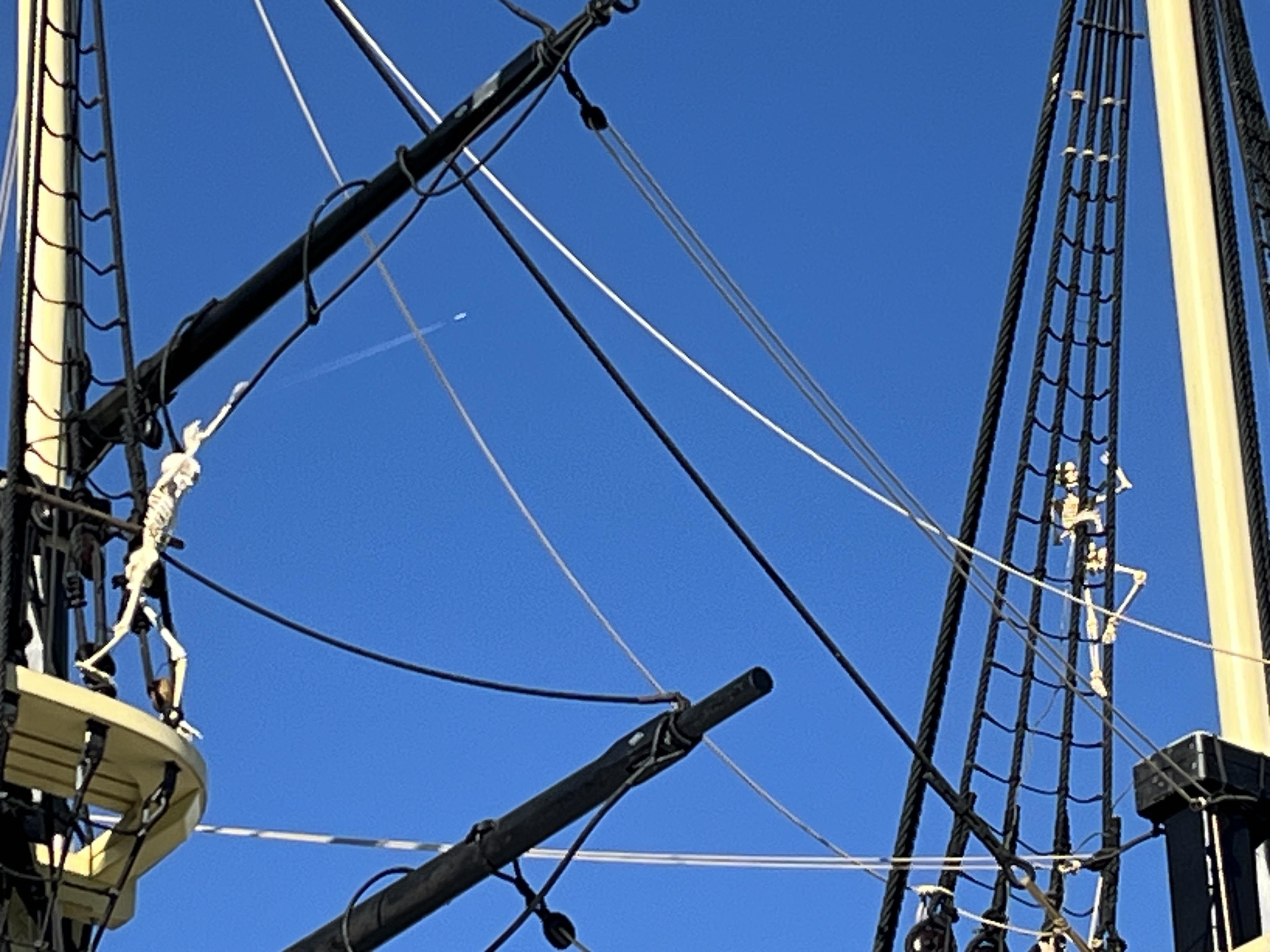 Two more skeletons. One is waving its arms in the mizzentop. The other is climbing the rigging on the foremast. Very nimble.