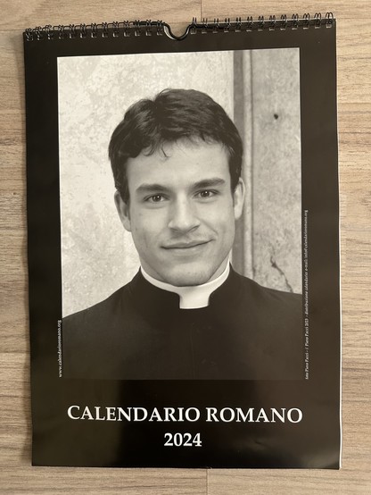 A calendar titled "Calendario Romano 2024" featuring a black and white portrait of a smiling man dressed in a clerical collar.