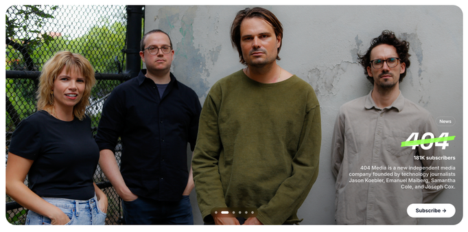 Photo of four people standing in a row, in front of a concrete wall and chain link fence. A woman and three men, all white and aged around their early 30s, dressed low-key hipsterish. A label identifies them as "404Media".