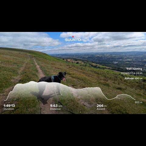 I didnt take a photo of all the litter I saw on this run, but trust me it was dirty. Paddy looking back at the camera with the trail leading into the distance on the hillside, with a very green welsh valley below big fluffy clouds above and my running stats imprinted on top