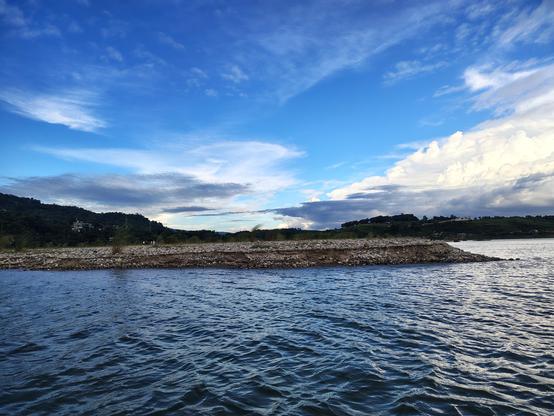 Breathtaking photography of Jaflong, Bangladesh showing river, river bank and vast blue sky