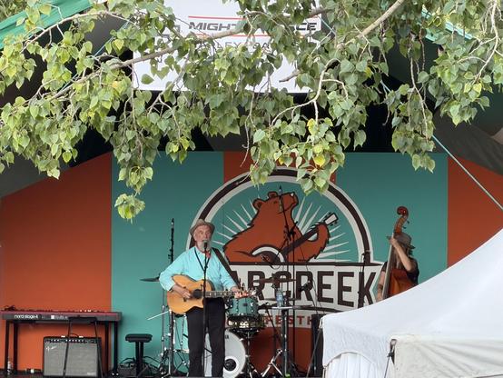 Fred Penner, the elder statesman of Canadian children’s music, ripping to up on stage.