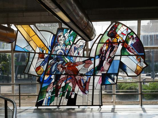 Window at the Prague metro station Invalidovna showing abstract basketball players(?)