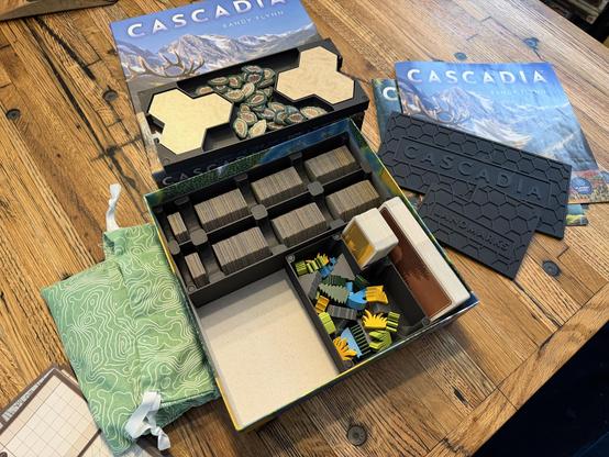 Open box of my copy of Cascadia showing the three piece organizer for all the various pieces.