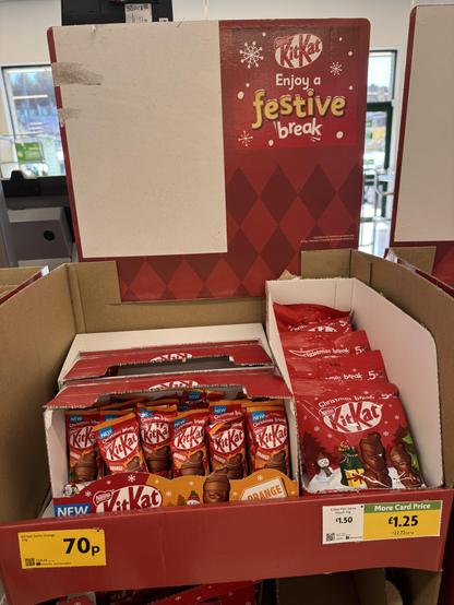 Picture of sweets on sale at a local supermarket with snowflakes and “festive” in the motif.