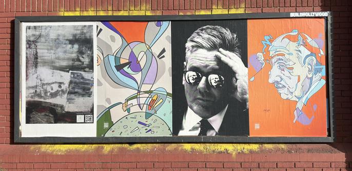 A row of posters. Two are abstract art, one looks like an elderly french man. The final one is a monochrome photo of Kier Starmer. Reflected in each lens of his glasses is an image of Margaret Thatcher