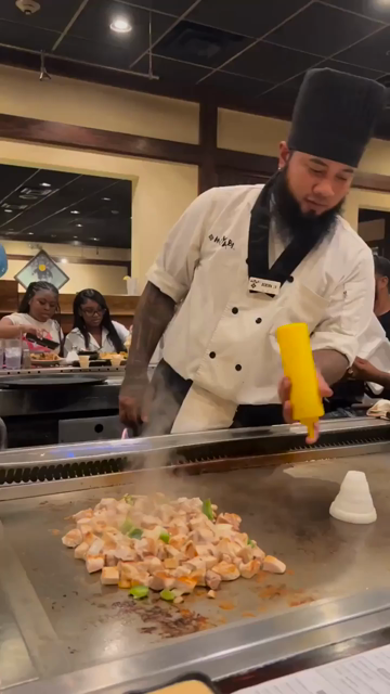 A chef playing music with kitchen tools