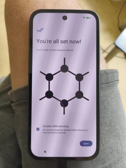 a welcoming screen on a phone while setting it up. it shows the molecule graphene