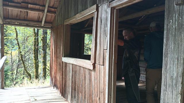 This cabin has an addition on the back made of milled planks but the floor and roof are both split cedar and the front room is logs. Here you can see the rough carpentry of the window and door frames.
