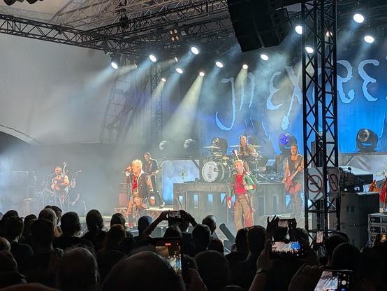 In Extremo on stage, modern instruments and bagpipes