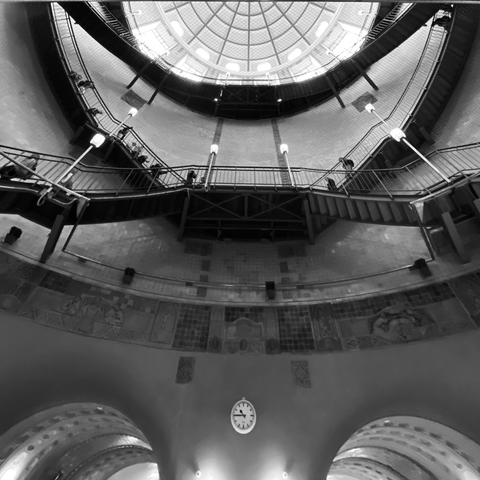 looking up from the north end of the alter elbtunnel. a clock on the wall between the tunnels reads 1045.