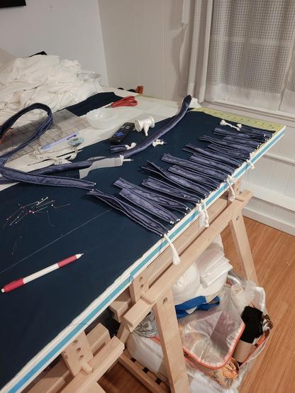 The center front of the Regency coat I am making. About half the length has strips of trim cut up.