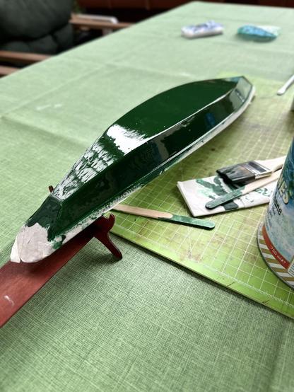 The hull upside down on the table. Fresh varnish on the hull.
