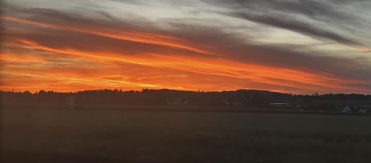 A gorgeous toffee stretched sunset taken from a fast moving train
