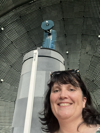 Me touring European Microwave Signature Laboratory (EMSL) and standing in front of a huge satellite receiver