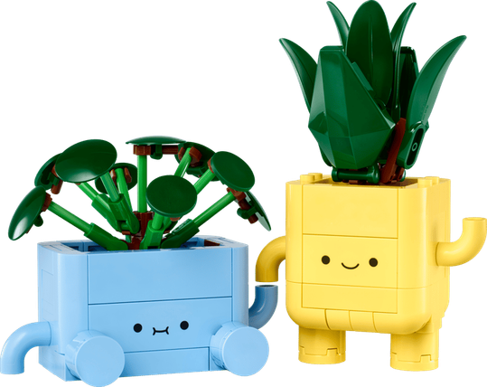 Two Lego planters, one in light blue and the other in yellow both with cute little faces on them. Each has a Lego plant coming out the top.