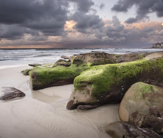 A color photograph of rock formations along the coast of La Jolla, San Diego, California. I captured this scene at sunset as rain approached.