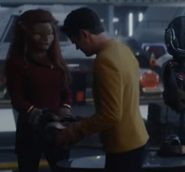 Kirk turns to a Catian officer, who HAS to be Lt. M'Ress. Ostensibly from "Tomorrow's Enterprise" -- the SNW s4 finale, according to the linked review.