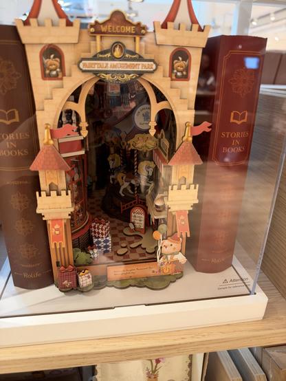 A book book with a medieval castle and a carrousel in the back