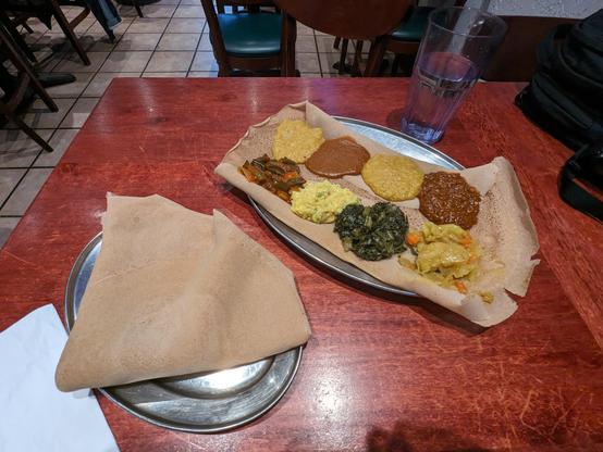 The vegetarian combo, eight vegetable stews on injera.