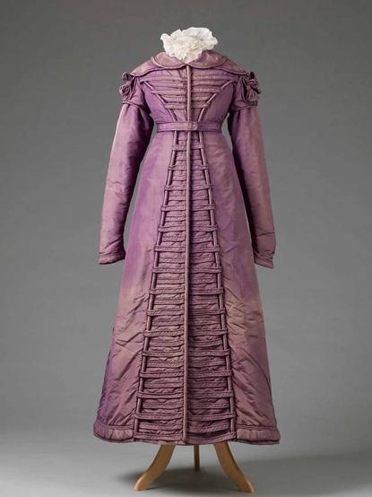 The orginal coat dress I copied.

It is largely the same, but with a few differences. Mostly, it is a faded purple color and of a dull silk trimmed with silk satin.