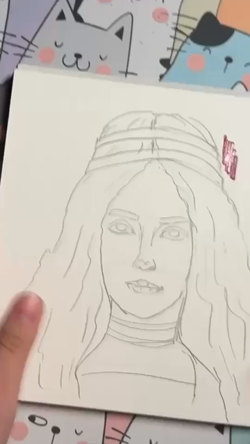 A process video showing a top down view of painting a portrait in acrylic markers.