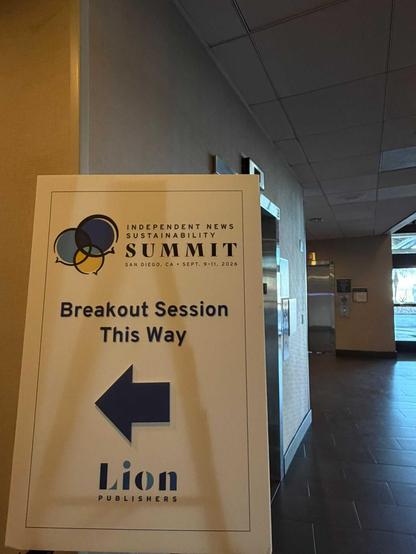 A banner reading 'Independent News Sustainability Summit. San Diego, CA. Sept, 9-11, 2026. Breakout session this way. Lion Publishers.