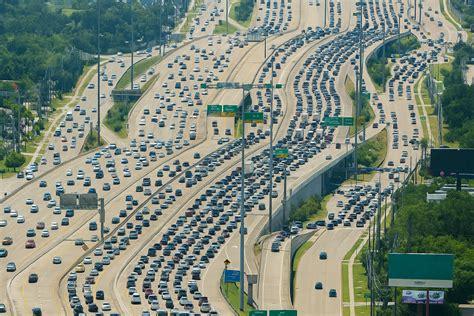 The 26 lane, Katy Freeway from Houston to Eastern Texas, USA. 

source https://supercarblondie.com/widest-highway-in-the-world-houston-texas-26-lanes-katy-freeway/
    https://en.wikipedia.org/wiki/Interstate_10_in_Texas