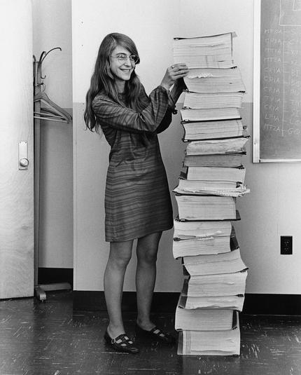 Margaret in 1965 with a printout of the Apollo guidance software that the team worked on.

I had this picture up on my offoce wall back in the day.