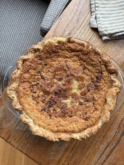 buttermilk chess pie, a little too dark, on a wooden table