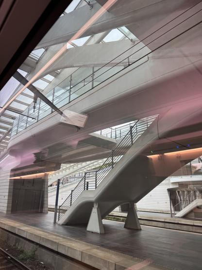 Part of the Liége central station roof structure and stair case to an upper floor. In Calatrava style lots of natural lines. Lots of glass.