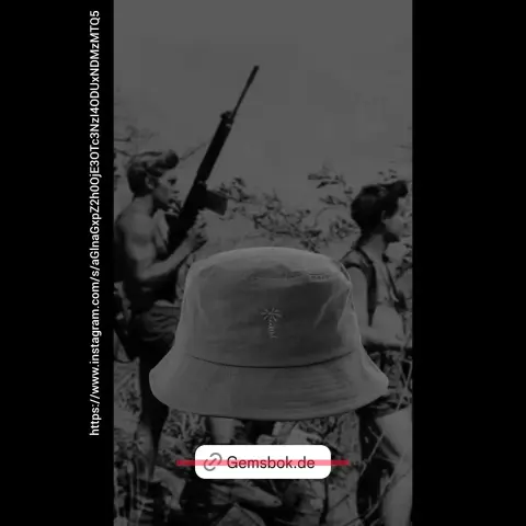Screenshot des Gemsbok Instagramaccounts 
Im Bild ist ein Fischerhut mit Palmenstickerei aus dem Shopangebot zu sehen. Im Bildhintergrund sind Rhodesische Buschkämpfer mit Sturmgewehr zu sehen.