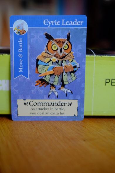 A playing card depicting one of the bird people leaders. This one is an owl with a sinister look and a dagger in its... hands?