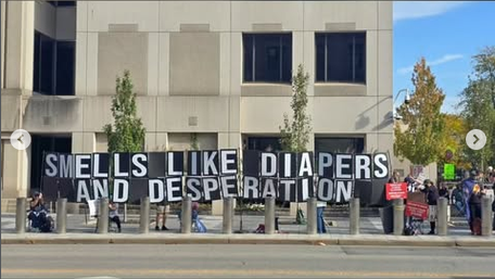 Outside a Trump rally in Youngstown Ohio protestors are holding up a banner that says "SMELLS LIKE DIAPERS AND DESPERATION," which is very true, both because of the diaper stench and the fact that Trump should not need to shore up a red state like Ohio, especially not a red part of the state.