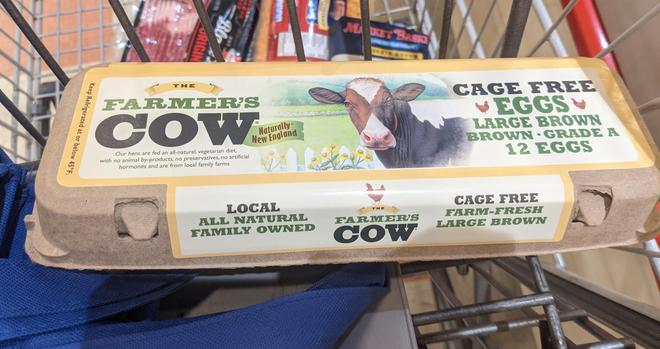 Carton of "farmers cow" brand eggs,