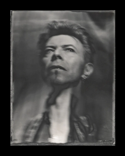 David Bowie, photographed by American photographer Frank W. Ockenfels III in 1996 during the photo sessions for Bowie's album *Earthling* (1997).

Ockenfels is known for his raw, experimental photographic style, which incorporates distortions, hand-drawn elements, and analog techniques.

This photograph is included in, among other works, the photobook *Collaboration: Frank Ockenfels 3 X David Bowie: Photographs*.