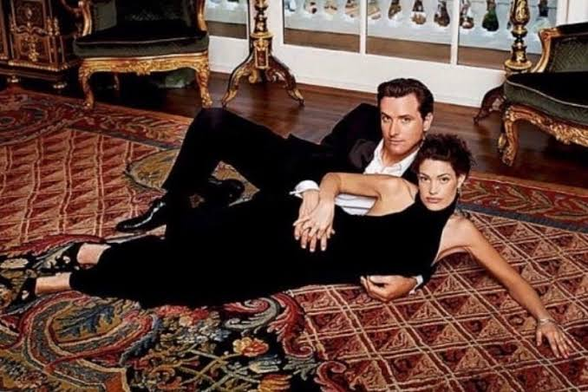 kimberly guilfoyle and gavin newsom, wed, inexplicably laying sexy on a nice rug in the house of a getty