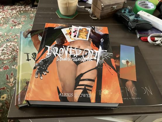 Copies of Tome 1 and 3 of "I Roved Out In Search of Truth and Love" are sitting on my messy coffee table