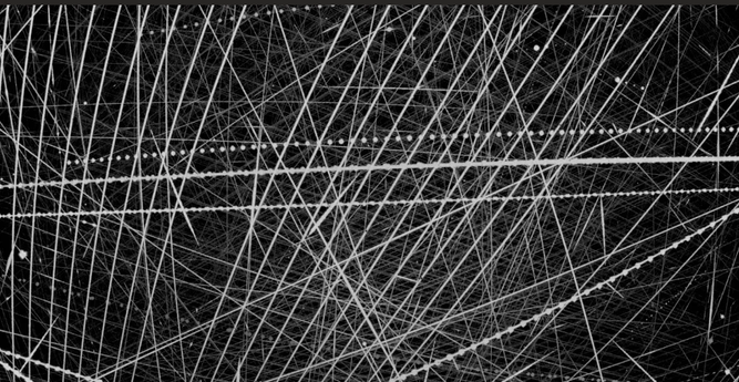 Extended Data Fig. 2 Survey data and sky coverage. a, Co-added image of all satellite detections on the night of 31 May–1 June 2024 from a single camera. Objects appearing as dotted lines are aircraft strobes and are rejected by software; meteor trails and trailed star images are also visible.