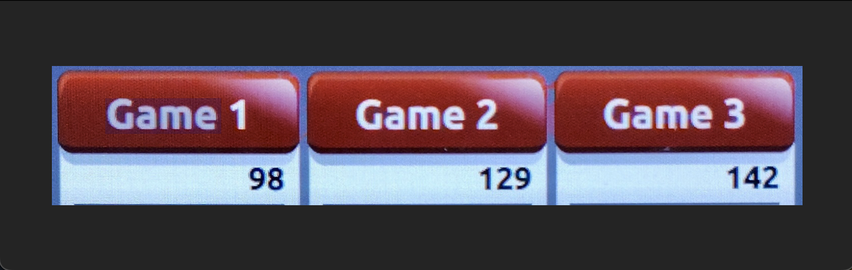 A screenshot of the computerized score tracker at a bowling alley, showing the scores from three games. 98, 129 and 142.