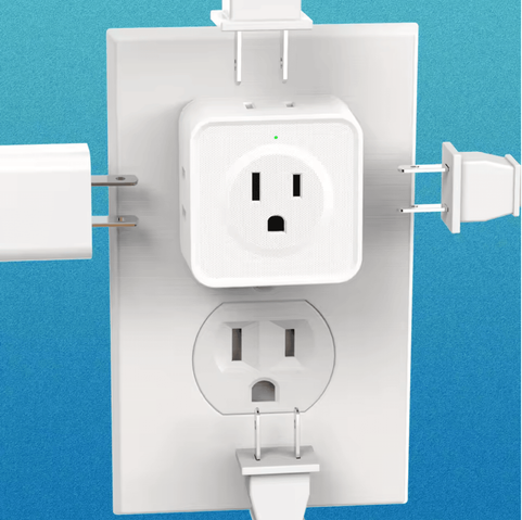 a picture of a US wall outlet with a multi-plug adapter plugged in. The front female port looks like a shocked face, and four male ends are approaching from all four sides