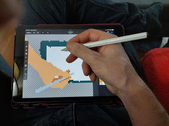 My take on Escher's Drawing Hands. One hand is drawn in pixel art on an iPad, the other hand is photographed holing a stylus and drawing the pixel hand.