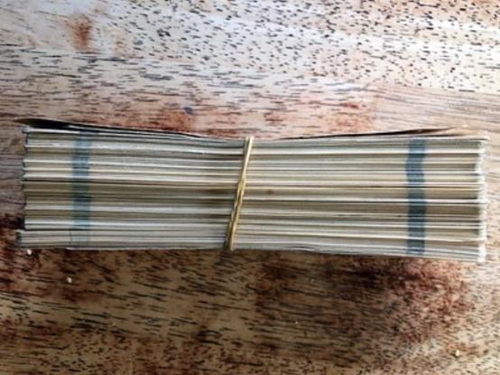 A block of FORTRAN  code held together with a rubber band. 

source https://www.flickr.com/photos/bootload/40810879513/