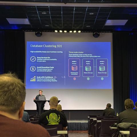 Janne presenting a lecture on "Database Clustering 101" at a conference, with a slide explaining three-node clusters and benefits of high availability.