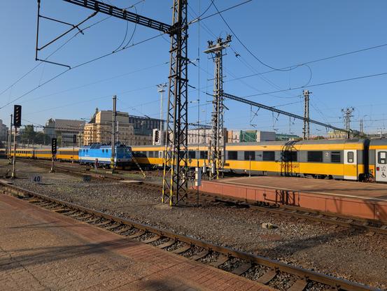 Yellow RegioJet train arriving to the station.