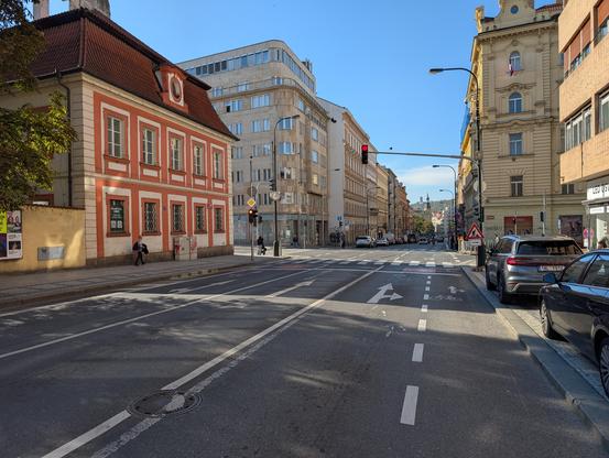 3-lane unidirectional highway with a small cycling lane in the dooring area of cars parked in parallel. The cycling lane didn't last 100 meters.