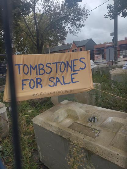 Oct 16, 2026: the fenced-in church yard, covered in massive concrete blocks. A hand-painted sheet says: "Tombstones for sale. Ask for Doug [Ford] (416) 325-1941"