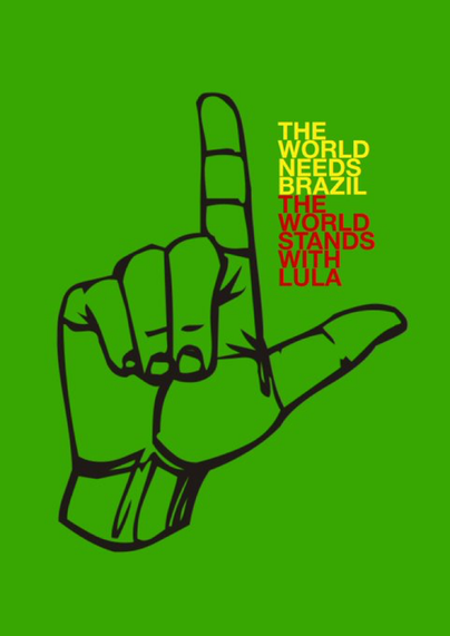 The image of a hand signing the “L” in Lula - “The world needs Brazil. The World stand with Lula.”
