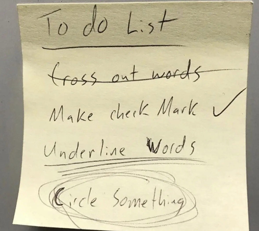 A handwritten to-do list on a yellow sticky note. The title reads 'To do List'. Below it, four tasks are listed and completed according to their literal instructions: 'Cross out words' with a line drawn through it, 'Make check mark' with a check mark next to it, 'Underline Words' with double lines under it, and 'Circle Something' with multiple circles drawn around it
