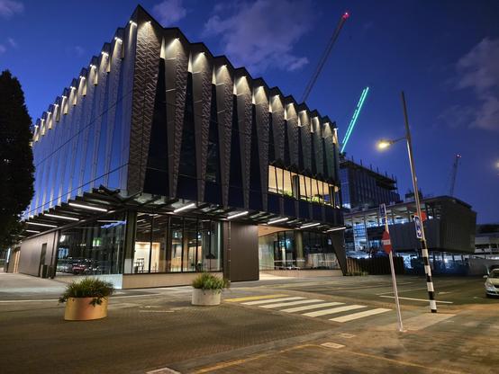The exterior is lit from the top, highlighting sculptural designs